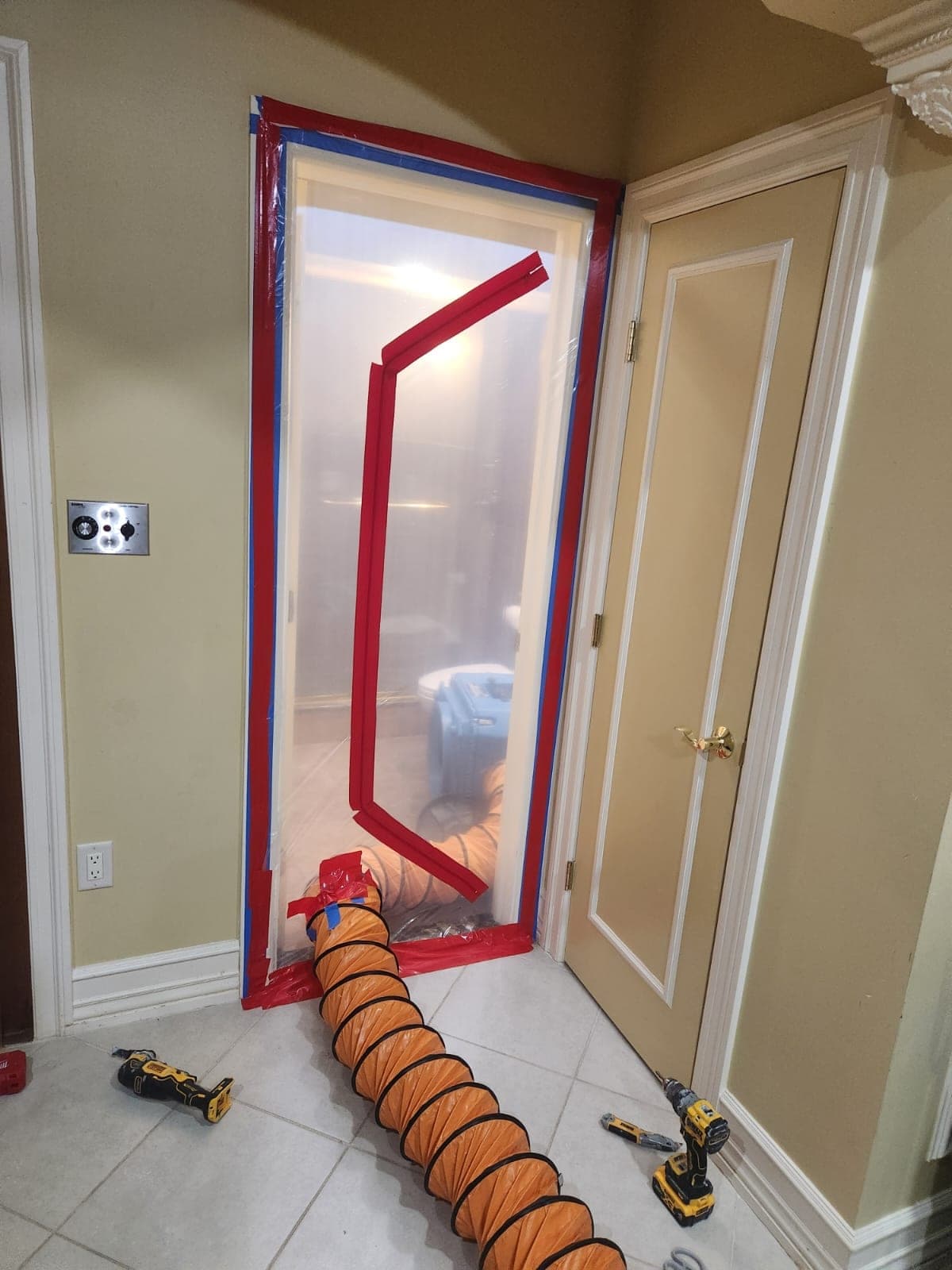 Zipper containment doorway with negative-air duct exhausting an air scrubber from a bathroom
