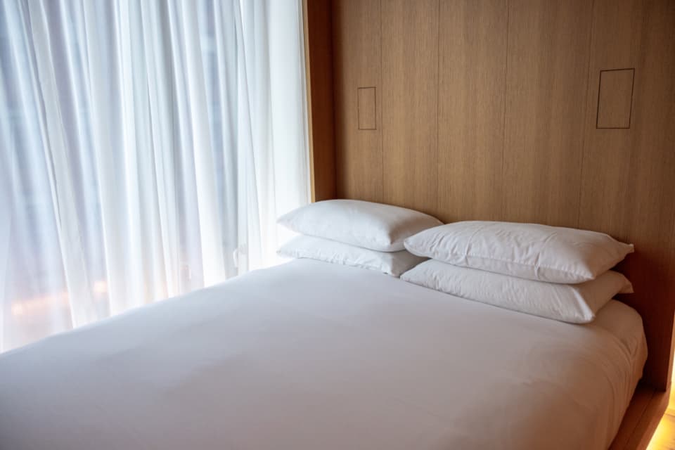 Mattress with fresh white bedding